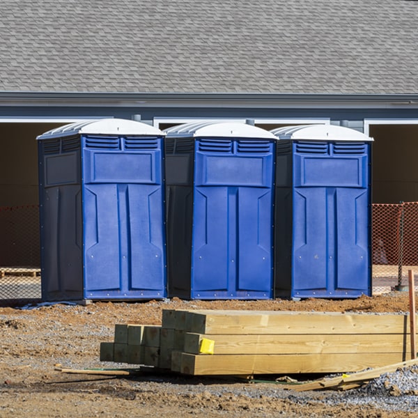 what is the cost difference between standard and deluxe portable toilet rentals in Cassville